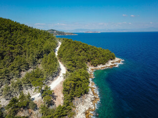 Aerial drone view of the beautiful coastline landscape , the sea and pine forest in Thassos , north-east side of Greece.