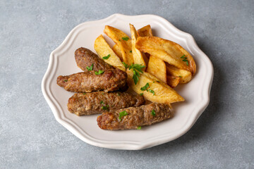 Traditional Turkish food; dry meatballs or inegöl meatballs with potatoes (Turkish name; Kuru kofte or anne koftesi)