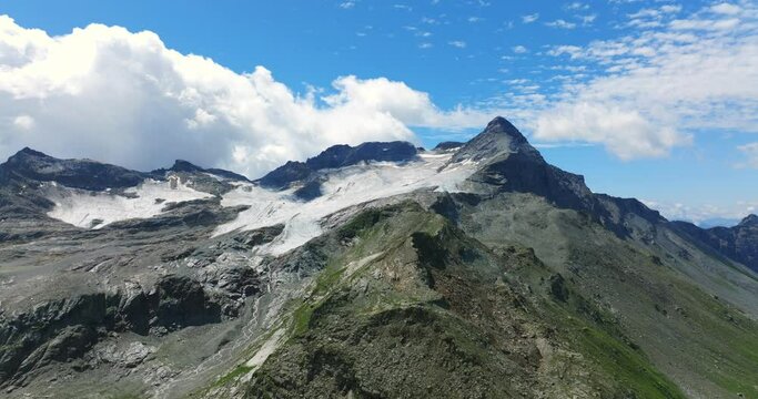 Incredible beauty of mountain peaks and glaciers of Valmalenco in summer season, Valtellina in Northern Italy. Aerial drone view