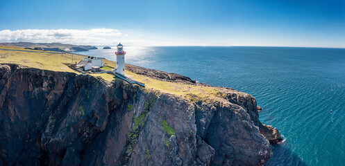 Aerial view of the lighthouse on the island of Arranmore in County Donegal, Ireland - Powered by Adobe