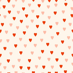 Cute hearts seamless pattern. Random romantic pattern in retro style. Simple vector red and pink hearts. Creative design for fabric, notebook, gift wrapping.