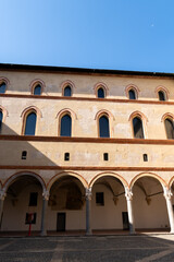 Fototapeta na wymiar The columns of the yard of Sforza Castle. Milan, Italy