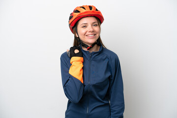 Young cyclist Lithuanian woman isolated on white background laughing