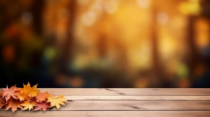 Naklejka na ściany i meble Wooden table with maple leaves on autumn background