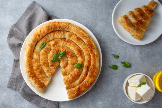 Spanakopita, greek phyllo pastry pie with spinach and feta cheese filling. Delicious handmade pies. Turkish name; el acmasi borek, rulo borek