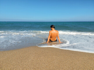 girl swimming among the waves in Cabo de Gata Almería