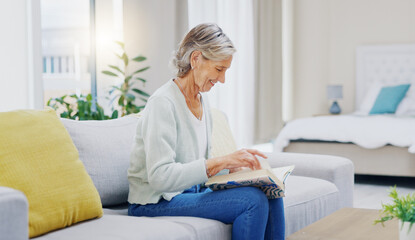 Senior woman, book and reading to relax in living room for story, novel and knowledge. Elderly...