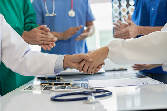 Cooperation and teamwork in the hospital for success and trust in the team. scientific cooperation agreement handshake agreement Innovation and contract research laboratory scientists