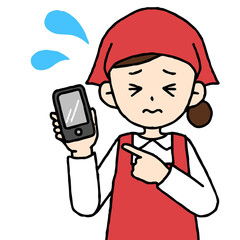 スマホを片手に持って焦るスーパーの店員