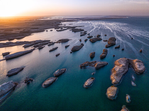 Yardang landforms in the water in sunset