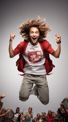 young man smiling euphoric jumping isolated on background