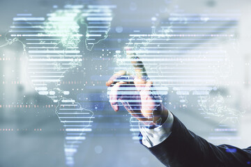 Man hand clicks on abstract creative digital world map on blurred office background, globalization...