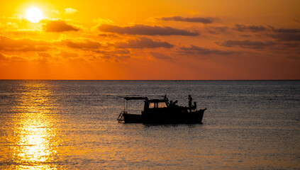 Sılhouette vıew of the port and breathıng at evenıng sunset