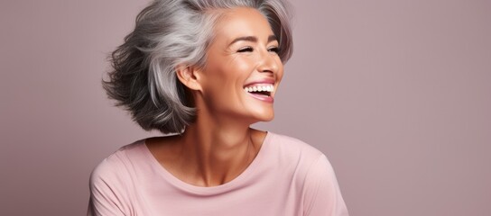 Middle aged woman looking great with wrinkled well-groomed beautiful skin on her face, isolated background, banner for advertising age skin care - obrazy, fototapety, plakaty