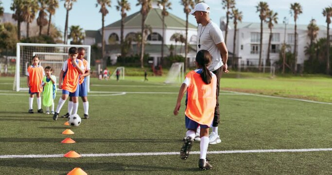 Soccer, kid and training for game and sport drill for workout and exercise on a school fitness. Students, person coaching and children with teamwork, player ball and team with youth athlete group