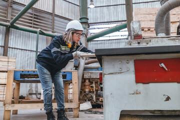 Fototapeta premium Wood turning operator ensures precision, quality to meet industry standards and customer requirement
