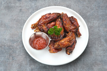 Roasted chicken wings with honey and spices 
