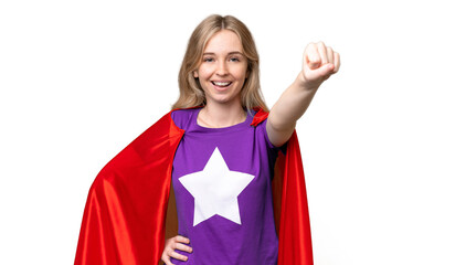 Young English woman over isolated background in superhero costume with proud gesture © luismolinero