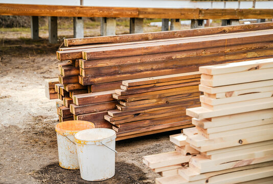 Fire bioprotection of wood. Impregnation, protective coating  for boards, beams. Waterproof protection  from moisture, fungus, molds. Building site.  Wooden frame house. Natural eco-friendly materials
