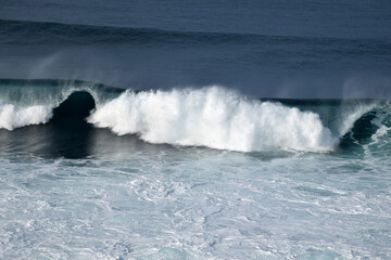 beach waves on a sunny morning, beach waves break the calm on the beach