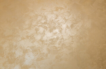 golden texture background. The texture of golden decorative plaster or concrete. Abstract grunge background for design. background texture of gold foil