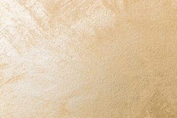 golden texture background. The texture of golden decorative plaster or concrete. Abstract grunge background for design. background texture of gold foil