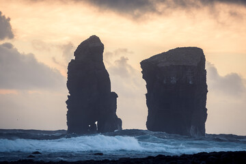 The sea stacks of Mosteiros at sunset with high waves in the foreground, Sao Miguel Island, Azores Islands, Portugal, Atlantic