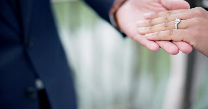 Couple, hands and ring for marriage, love or wedding in ceremony, commitment or support together. Closeup of people getting married, vows or accessory for symbol of bond, relationship or partnership
