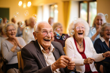 Funny entertainment event for old pensioner people in nursing house, seniors gather together sit in conference hall clap hands enjoy soap bubble performance, laughing feel happy. Carefree retired life