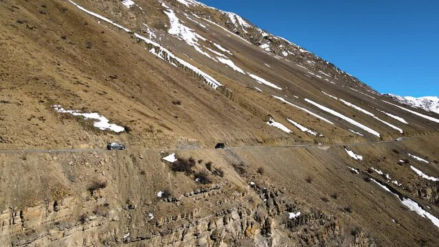 Drone following a car in spiti valley himachal pradesh sand mountain india 