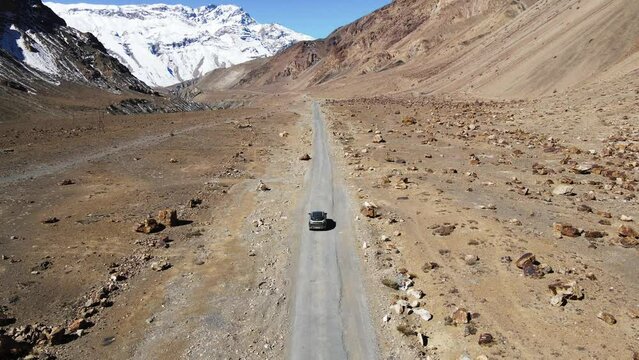 drone following n car in spiti valley himachal pradesh sand mountain India 