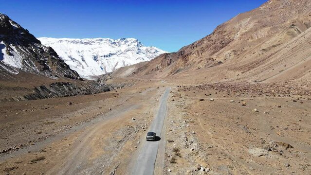 drone following car in spiti valley himachal pradesh sand mountain India 