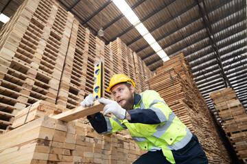 Fototapeta premium Wood turning operator ensures precision, quality to meet industry standards and customer requirement