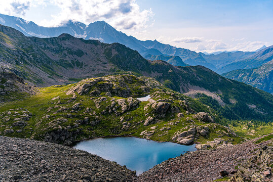 Beautiful nameless mountain lake view from Cima Verosso on the border of Italy and Switzerland, Zwischbergen, Valais, Switzerland