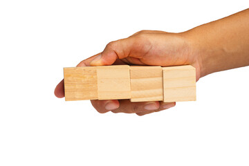 Close-up of hand holding four wooden cubes on a transparent background