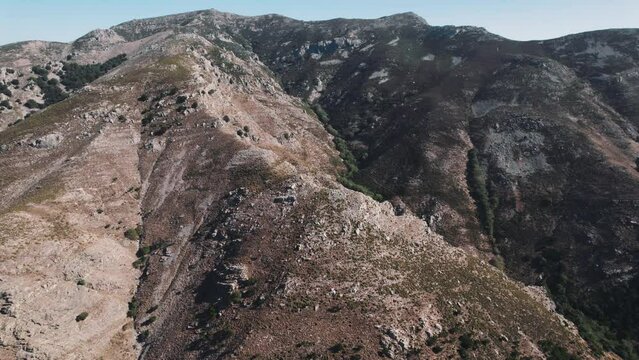 Wild and impressive landscape of Topolia Gorge in Crete. Beautiful raw hills and mountains in Greece. Aerial perspective. High quality 4k footage
