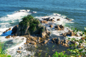 Beautiful sea rocks on which the wave hits .