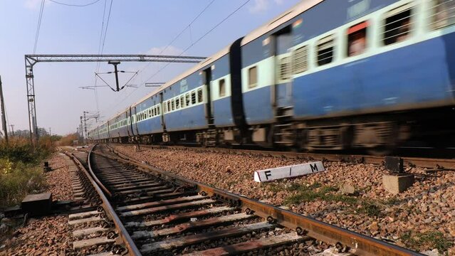 High speed Indian train crossing railroad station perspective view