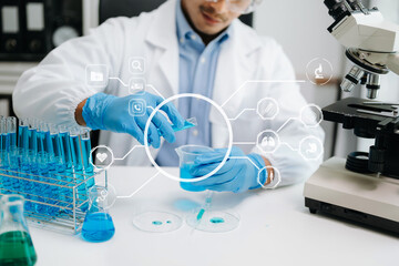Fototapeta premium Healthcare professional holding Coronavirus COVID 19 vaccine in laboratory study and analyze scientific sample of Coronavirus antibody in lab.