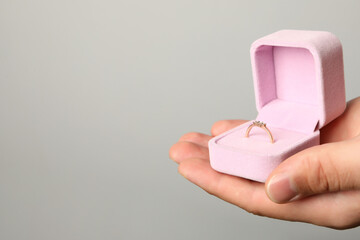 Gold women's engagement ring in a soft, velvet case.