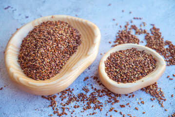 Linseed in a blue bowl . Flax seed 