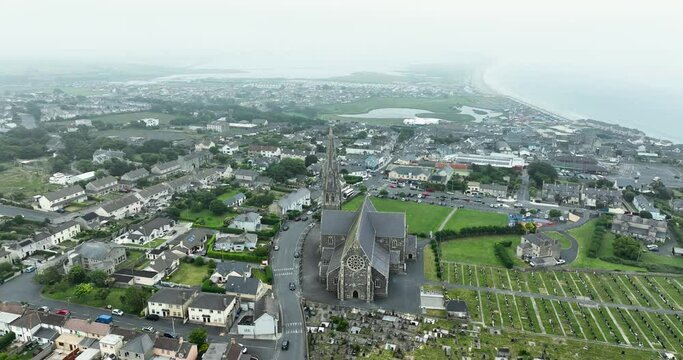 Flying over Catholic Church which overlooks the entire coastal town of Tramore