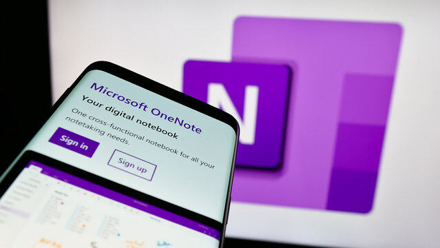 Stuttgart, Germany - 09-21-2023: Mobile phone with website of note-taking software Microsoft OneNote on screen in front of business logo. Focus on top-left of phone display.