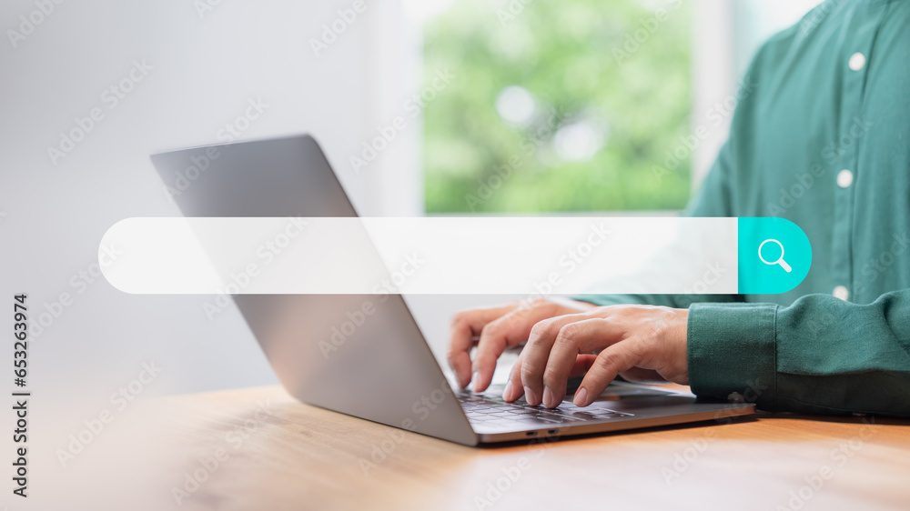 Poster Search engine optimization the internet with search bar. User working with a laptop computer on table in office. Best SEO technology networking, Searching browsing internet data information concept.