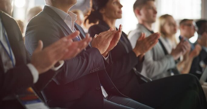 Close Up on Hands of Audience Applauding in Concert Hall During Business Forum Presentation. Technology Summit Auditorium Room With Corporate Delegates. Entrepreneurs Clapping, Slow Motion.