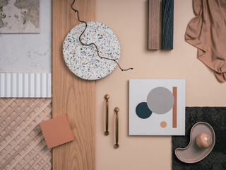 Aesthetic flat lay composition with textile and paint samples, panels, handle and cement tiles. Stylish interior designer moodboard. Light beige color palette. Copy space. Template.