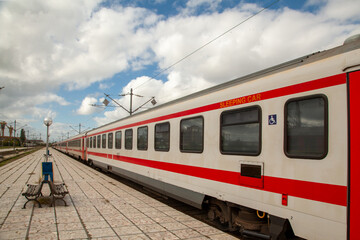Fototapeta premium Platform with bench and train at the train station