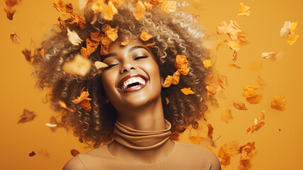 Beautiful african model with afro hair with autumn leaves
