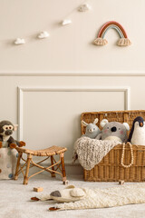 Interior design of kids room interior with wicker basket, plush animal toys, poster, wooden...