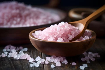Foto auf Alu-Dibond Pink Himalayan salt in a wooden bowl and a spoon nearby © Marina